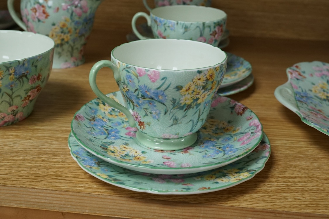 A Shelley ‘Melody’ porcelain six cup tea set, teapot missing, cake plate 25cm square (21)